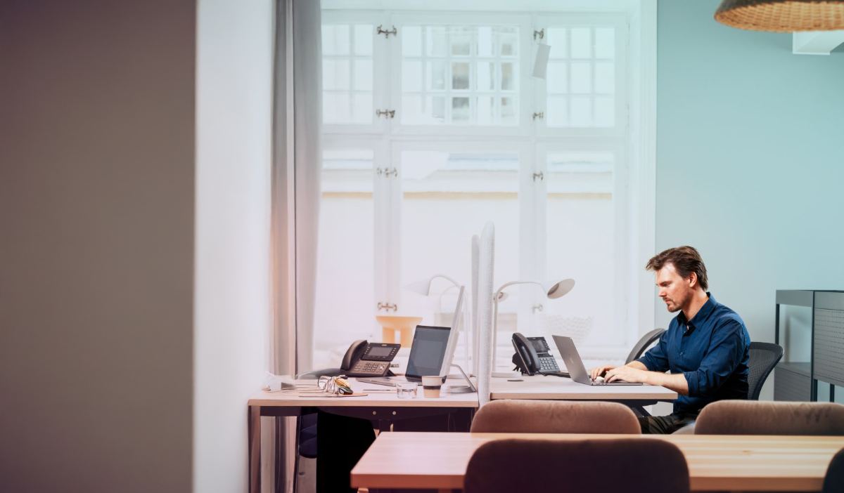 Office-woman-man-caucasian-laptop-headset-deskphone-window-dstnjpg - LR - 4 - LR