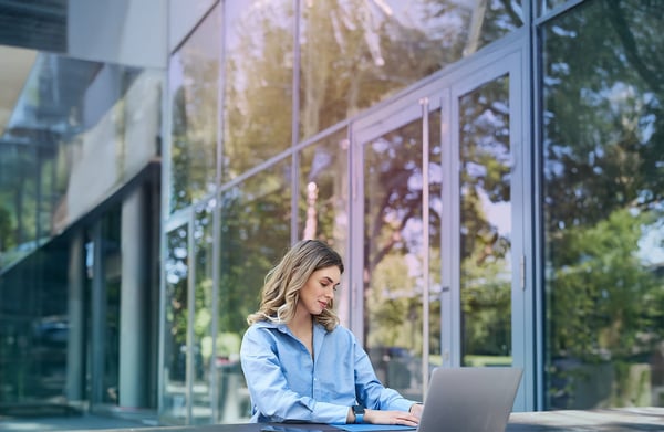 outside-woman-laptop-blue-shirtjpg (1)