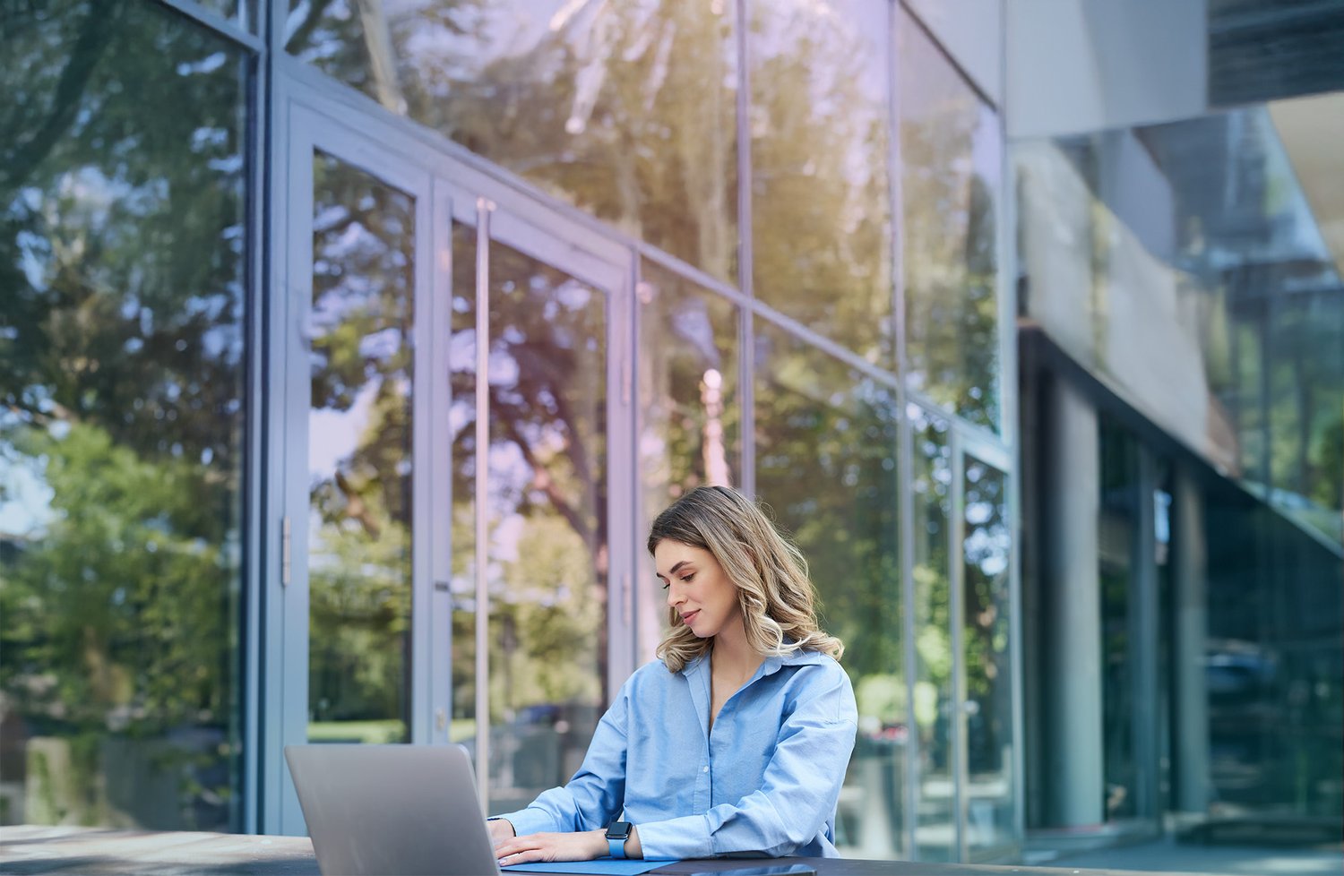 outside-woman-laptop-blue-shirtjpg