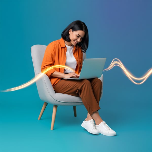 woman-working-laptop-sitting-modern-chair-studio